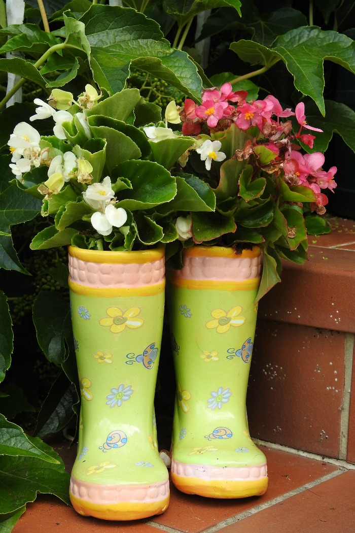 child's boots repurposed into planters