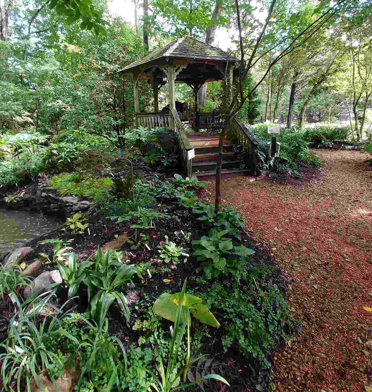 A gazebo in a peaceful meditation garden area.