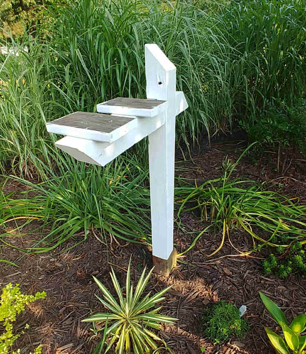 Mail box post, ready to hold the mailbox garden tool storage bin.